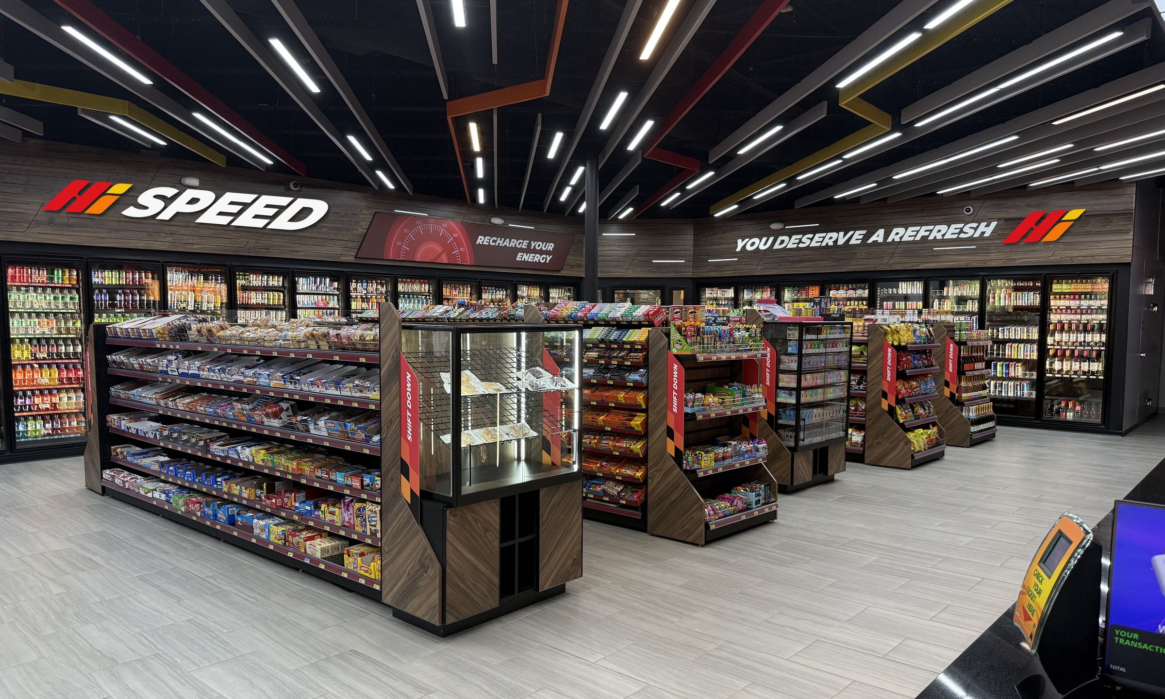 Inside the store: the Hi Speed sign over the cold vault, the snack aisles and the angled ceiling baffles