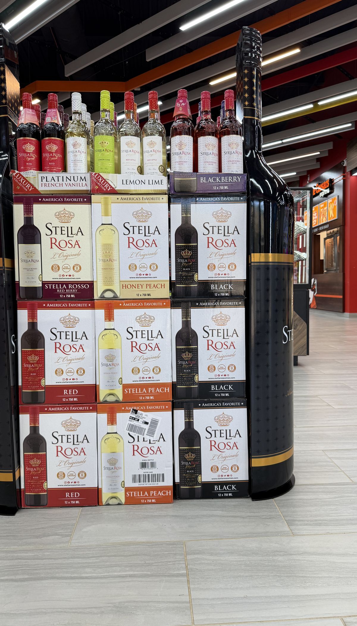 A tower display of Stella Rosa wines on the store floor